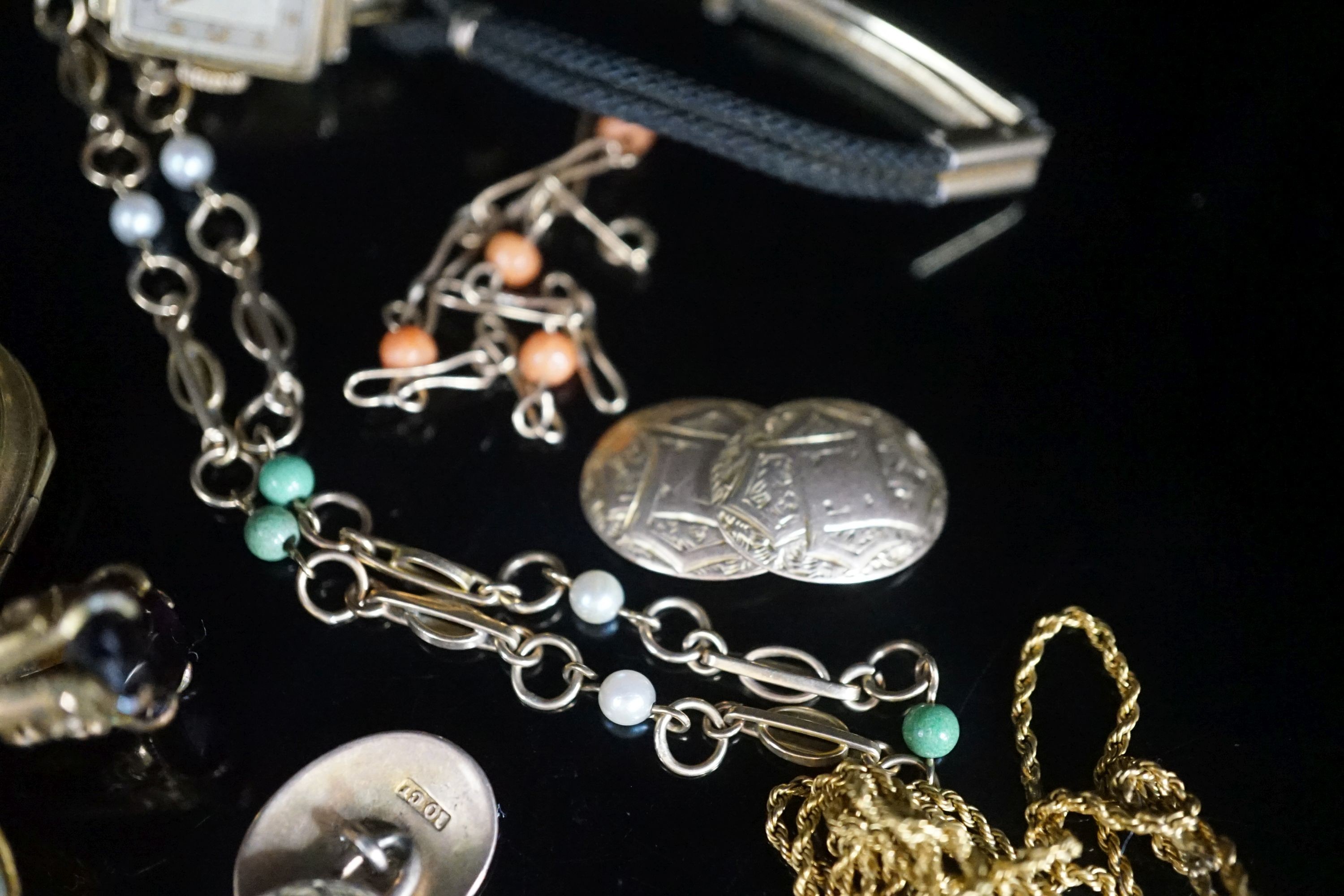 A group of mixed jewellery a pair of 10ct cufflinks, assorted fobs, a 9ct ropetwist chain(a.f.), a 9ct necklace, a 9ct gold small bracelet, wrist watch, locket etc.